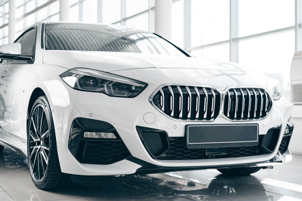 white luxury passenger car standing inside salon.jpg